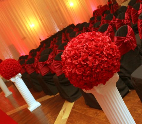 black and red themed hall setup at the Bayanihan Arts and Events Center for a wedding ceremony and reception in Tampa, Florida.
