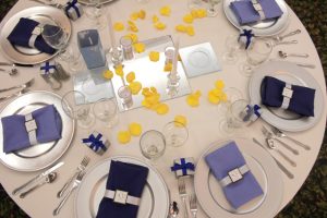 Blue and yellow theme hall setup at the Bayanihan Arts and Events Center as a wedding and reception venue in Tampa .
