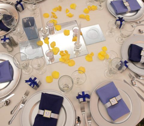 Blue and yellow theme hall setup at the Bayanihan Arts and Events Center as a wedding and reception venue in Tampa .